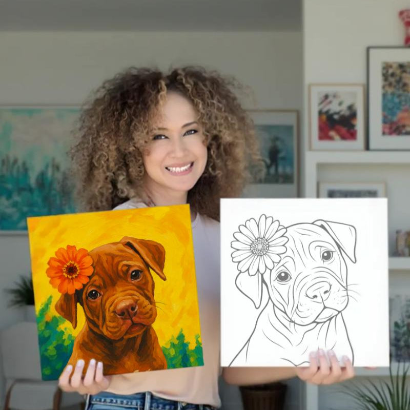Woman holding a colorful painting of a dog with a flower and a black and white line drawing pre-drawn canvas of a dog with a flower.